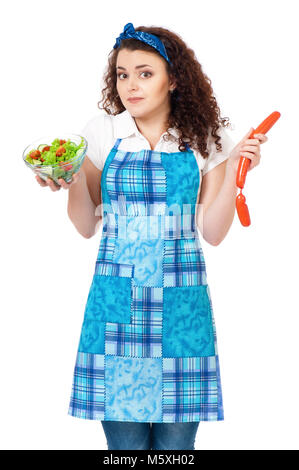 Junge Hausfrau auf Weiß Stockfoto