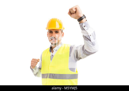 Erfolgreiche Ingenieur Architekt oder Bauträger, glücklich und fröhlich wie ein Sieger mit der Hand in der Luft ist, lächelt glücklich auf weißem Hintergrund Stockfoto