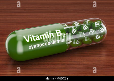 Kapsel Vitamin B12 auf dem Holztisch. 3D-Rendering Stockfoto