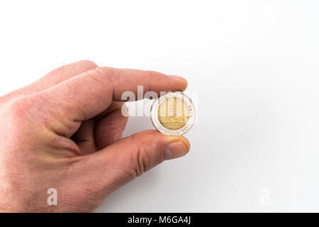 Eine Thailändische Münze von 10 Badewanne auf einer Hand Stockfoto