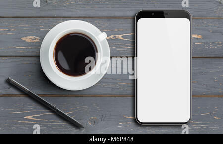 Smartphone Draufsicht auf alten Holztisch mit Stift und Kaffee Stockfoto
