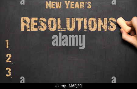 Das Wort New Year's Resolution an die Tafel geschrieben Stockfoto