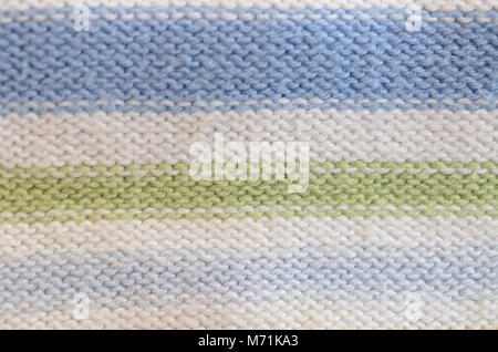 Textile Textur aus Wolle blau gelb grün weiß rot. Stockfoto