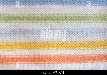 Textile Textur aus Wolle blau gelb grün weiß rot. Stockfoto