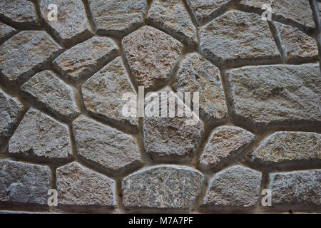 Detaillierte alte braune und graue Fett Steine wand hintergrund Textur Stockfoto