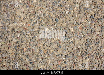 Pebbles Betonboden voller Hintergrund, Textur, Detailansicht mit Details, Ansicht von oben Stockfoto