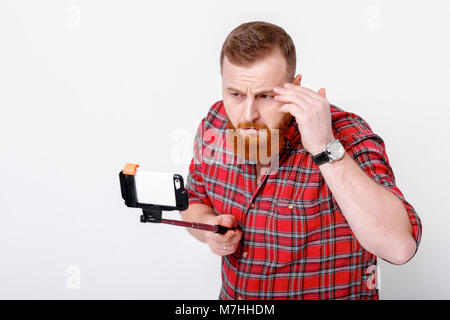 Man macht selfie auf Telefon Stockfoto