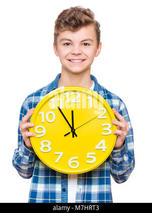 Teenboy mit grossen Uhr Stockfoto