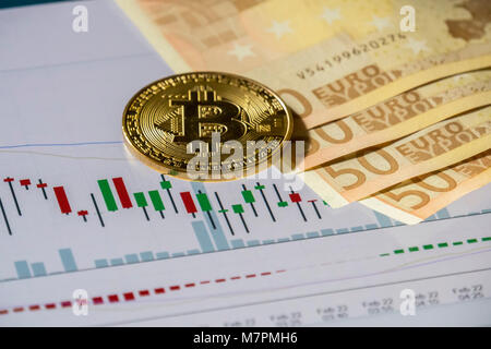 Cryptocurrency Münzen über Handel Grafik und Euro-banknoten zu kaufen und zu verkaufen; Bitcoin Münzen Stockfoto