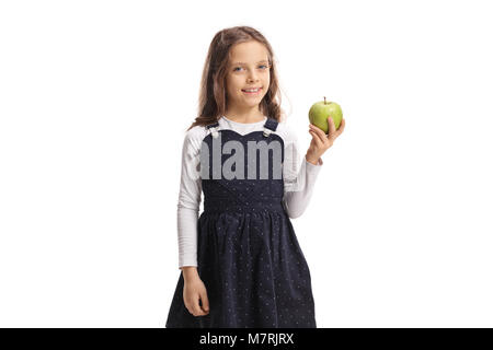 Süße kleine Mädchen mit einem Apfel und lächelnd auf weißem Hintergrund Stockfoto