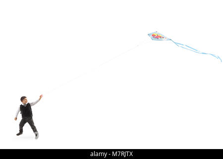 Volle Länge Profil Aufnahme eines Schülers flying a Kite auf weißem Hintergrund Stockfoto