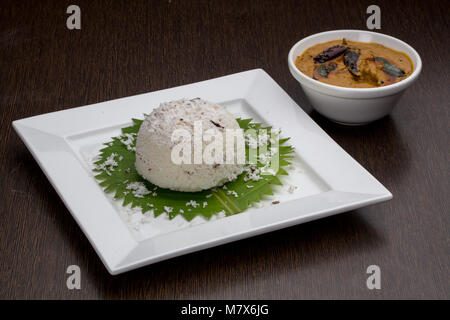 Puttu mit Fisch Curry Stockfoto