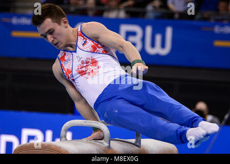 17 März 2018, Deutschland, Stuttgart: Turnen Wm, decicer, multi Herren- Disziplin, in der Porsche-Arena. Russlands David Beljawski in Aktion auf dem Pferd. Foto: Sina Schuldt/dpa Stockfoto