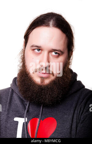 Portrait eines bärtigen jungen Künstler denkt, im Hintergrund. Stockfoto