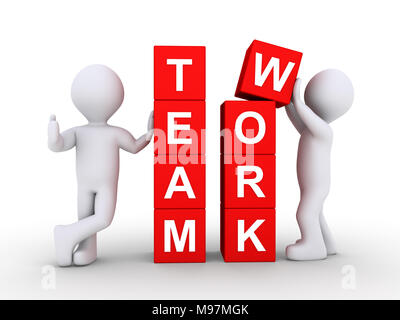 Zwei Personen bilden das Wort Teamarbeit mit Hilfe von Blöcken Stockfoto