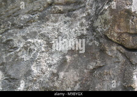 Raue Fläche teilen Stein Textur. Felsen grange Hintergrund für die Webseiten oder mobilen Geräten Stockfoto