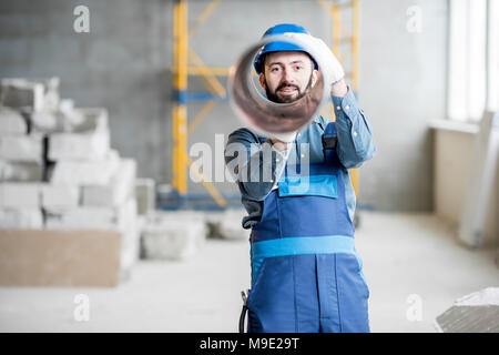 Builder mit Lüftung Rohr Stockfoto