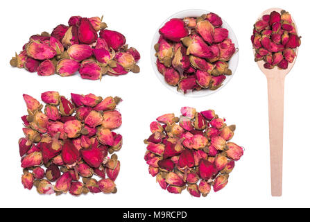 Große Kaffee von trockenen Rosenknospen isoliert auf Weiss. Trockene Rosen in Löffel aus Holz. Stockfoto