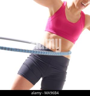 Junge Frau mit Kunststoff Hoop, Studio gedreht. Stockfoto