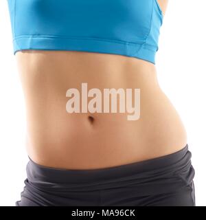 Junge Frau tragen sportliche Kleidung, Studio gedreht. Stockfoto