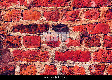 Red old worn brick wall texture background. Vintage effect. close up Stockfoto