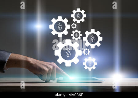 Geschäftsmann berühren Technologie Laptop mit Zahnrad einstellen. Stockfoto