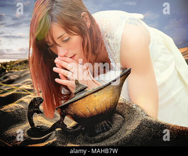 Mädchen beten auf Aladdin's Lamp Stockfoto