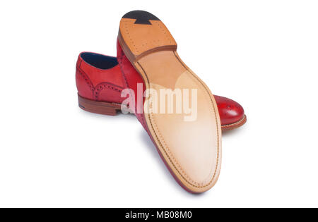 Studio Aufnahme eines Mans rot Leder brogue isoliert auf Weiss - Johannes Gollop Stockfoto