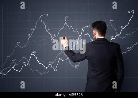 Junge Unternehmer im schwarzen Anzug vor einem Fortschritt chart Stockfoto