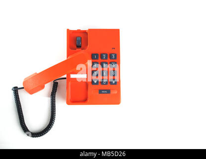 Orange Telefon isoliert auf einem weißen Stockfoto