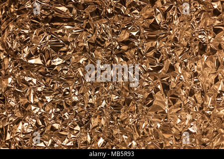 Full Frame nehmen Sie ein Blatt zerknüllt gold Aluminiumfolie Hintergrund Stockfoto