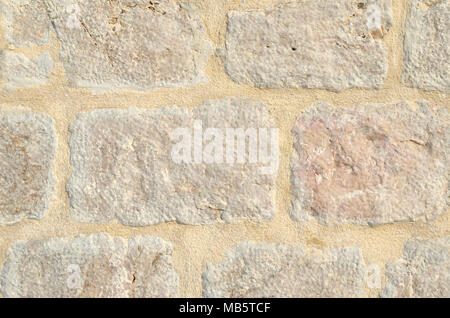 Grunge stein Wand aus beigem Stein Würfel - geeignet als Hintergrund Stockfoto