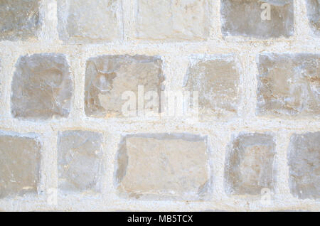 Grunge Steinmauer Oberfläche aus Beige und Grau Stein Würfel - geeignet für einen Hintergrund Stockfoto