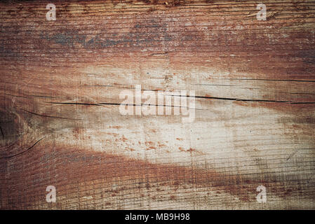 Holz Textur in warmen goldenen und braunen Tönen. Alte ländliche Holzwand, detaillierte plank Zaun Foto Hintergrund. Natürliche Holz- Gebäude. Stockfoto