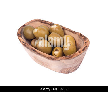 Grüne kolossale Oliven gefüllt mit Knoblauch Handschuhe Hand in Olivenholz Schüssel Stockfoto
