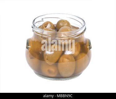 Grüne kolossale Oliven gefüllt mit Knoblauch Handschuhe Hand in den jar Stockfoto