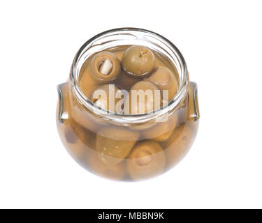 Grüne kolossale Oliven gefüllt mit Knoblauch Handschuhe Hand in den jar Stockfoto