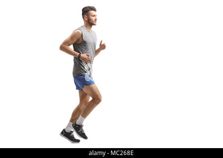 Volle Länge Profil Schoß eines jungen Mannes in Sportkleidung auf weißem Hintergrund läuft Stockfoto
