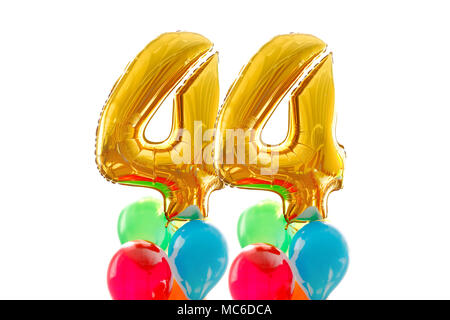 Goldene Zahl 44 40 vier aus aufblasbaren Ballon farbigen Luftballons weißer Hintergrund Stockfoto