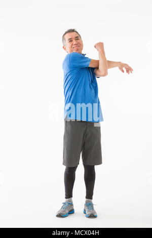 Senior woman Dehnung Stockfoto