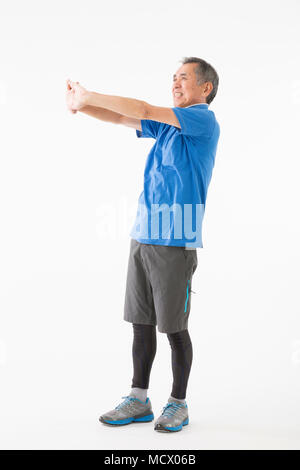 Senior woman Dehnung Stockfoto