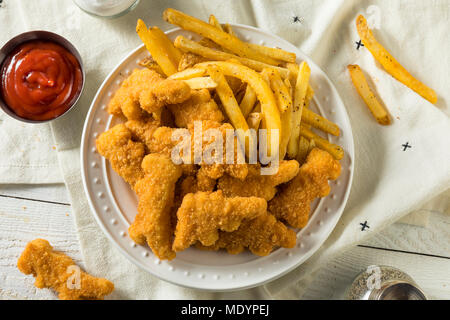 Kinder Dinosaurier geformte Chicken Nuggets bereit zu Essen Stockfoto