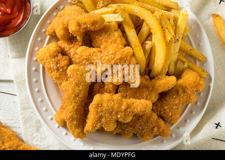 Kinder Dinosaurier geformte Chicken Nuggets bereit zu Essen Stockfoto