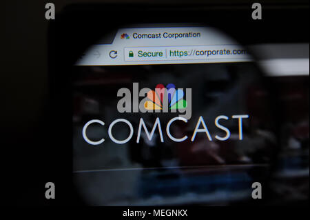 Die Comcast Website durch eine magnifiying Glas gesehen Stockfoto