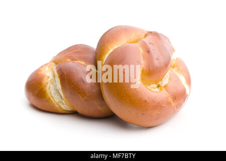 Leckere gebackene Brötchen auf weißem Hintergrund. Stockfoto