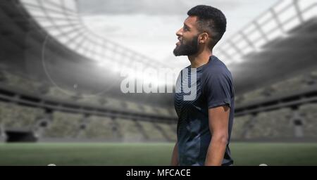 Sport Player auf einer Rasenfläche mit Stadion Stockfoto