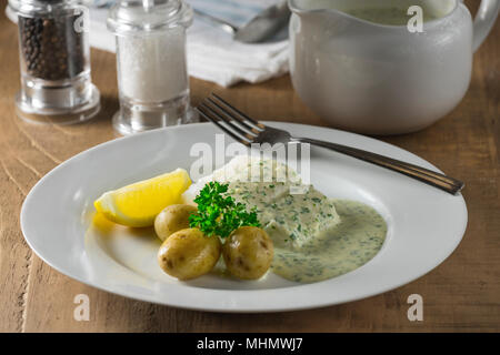 Kabeljau in Petersilie. Stockfoto