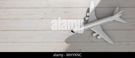 Leere Commercial Airplane mit vier Motoren, auf Holzboden Hintergrund, Ansicht von oben, kopieren. 3D-Darstellung Stockfoto