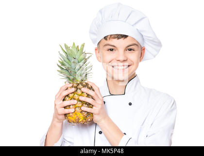 Teenboy tragen Chef uniform Stockfoto