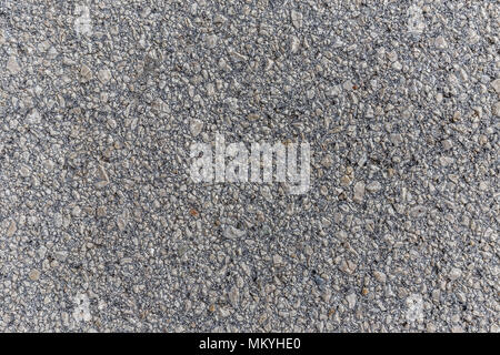Konkrete Textur mit kleinen Bruchteil Felsen im Inneren. Stockfoto